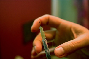 A needle being prepped before injection