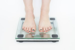 A woman weighing herself